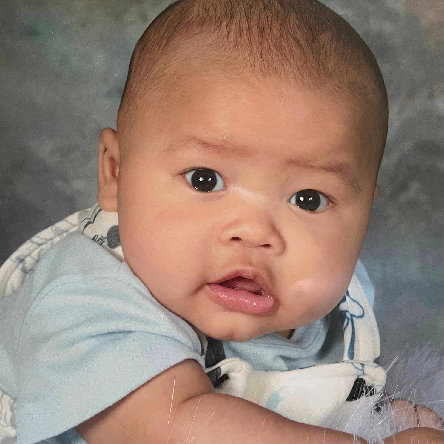 Dakari joined the competition — help win amazing prizes! baby, biting, face, frown, happy, head, newborn, person, photography, portrait, sad