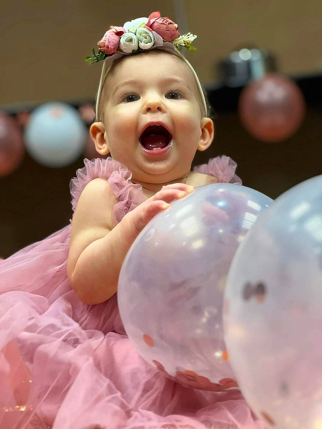 Kari joined the competition — help win amazing prizes! baby, baby_toddler_clothing, child, event, facial_expression, fashion_accessory, flash_photography, fun, gesture, grass, happy, headband, headpiece, jewellery, party_supply, peach, person, pink, portrait_photography, smile