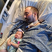 Margueritte joined the competition — help win amazing prizes! baby, blanket, bow, care, child, family, hospital_bed, hospital_gown, indoor, infant, love, man, medical_tube, pacifier, peaceful, person, pillow, rest, sleeping, tattoo