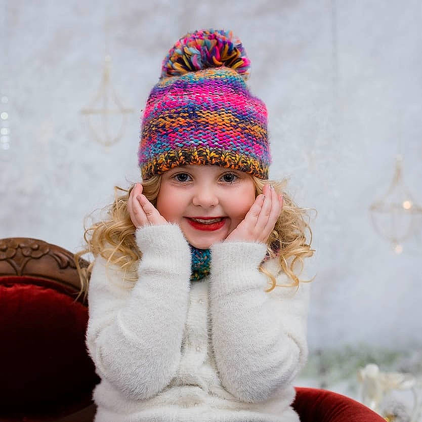 Haley is registered to the contest to win money with this photo: beanie, bonnet, cap, child, crochet, fur, girl, hat, headgear, joy, knit_cap, knitting, material, person, scarf, sun_hat, textile, thread, toddler, winter