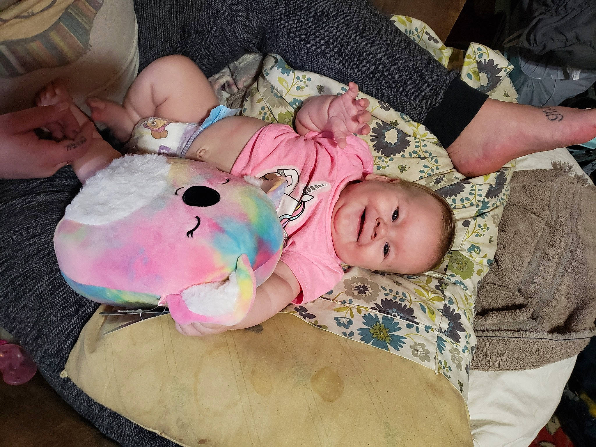 Kahlia is registered to the contest to win money with this photo: baby, baby_products, baby_toddler_clothing, cheek, child, comfort, finger, joy, lap, linens, mammal, person, pink, room, sitting, stuffed_toy, toddler, toy