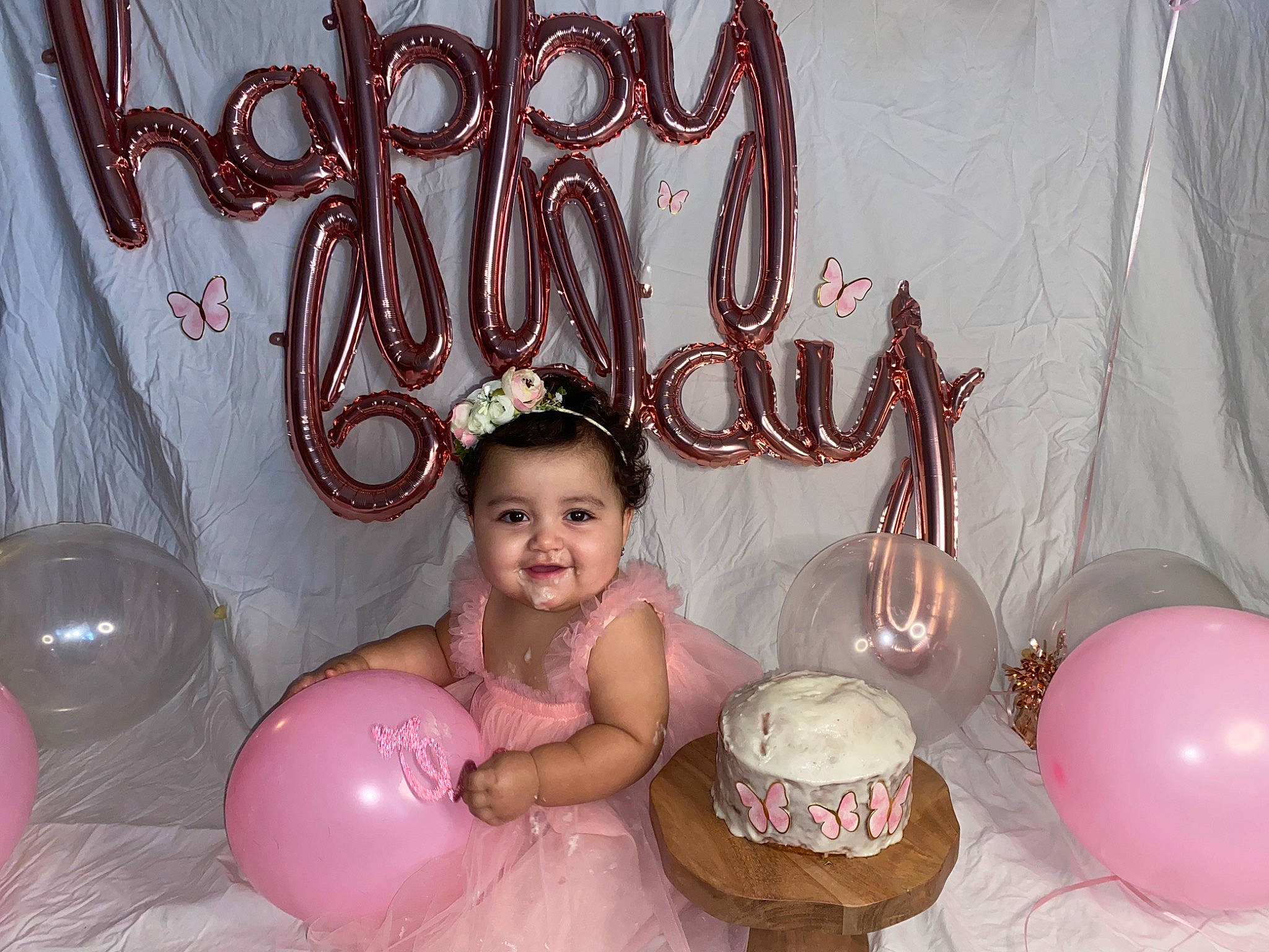 Layla is registered to the contest to win money with this photo: baby, balloon, birthday, birthday_party, cake, child, decoration, event, fun, happy, icing, joy, lighting, magenta, party, party_supply, person, pink, smile, sugar_cake