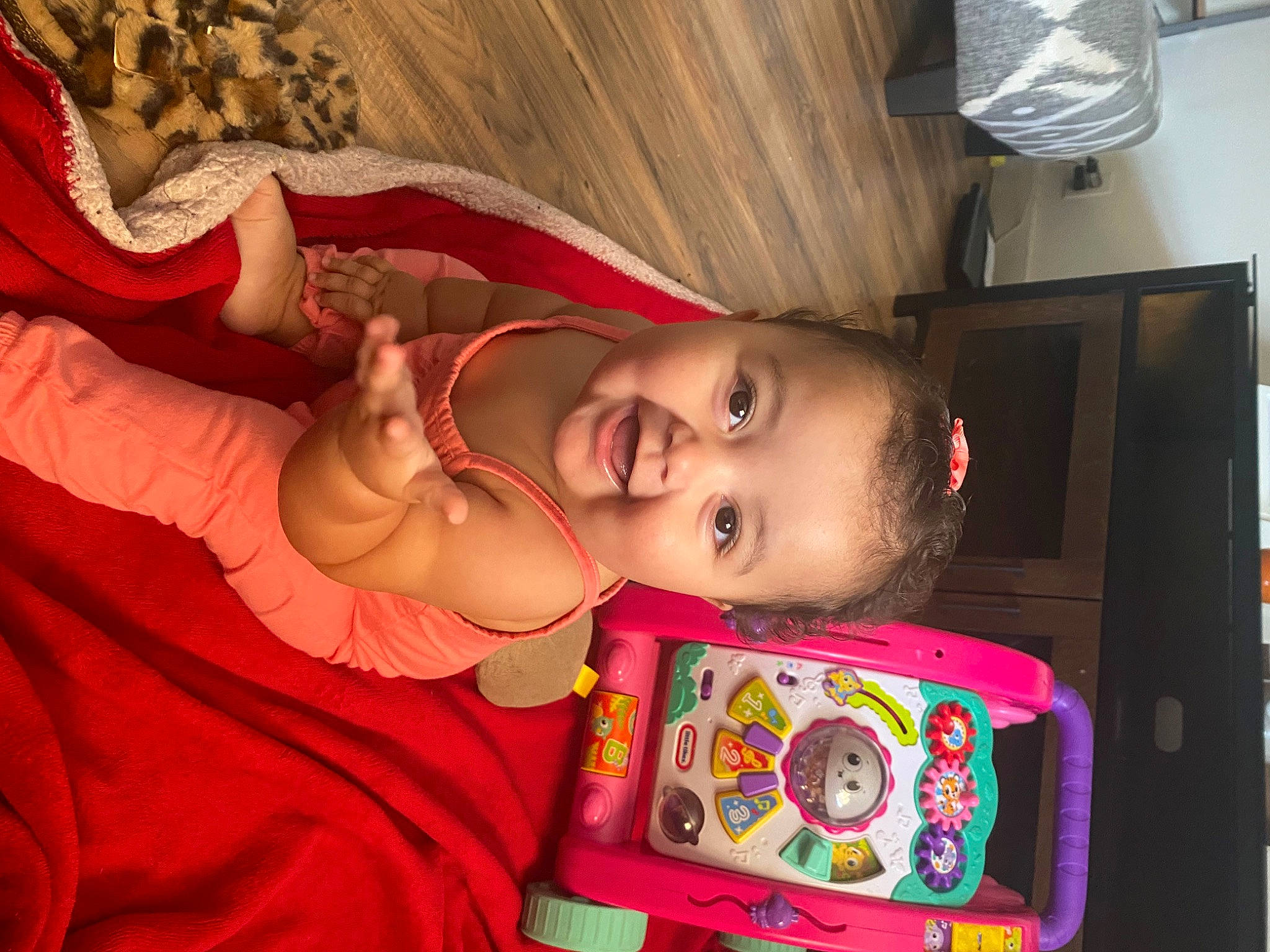 Layla is registered to the contest to win money with this photo: art, baby, baby_toddler_clothing, cheek, child, eyelash, fashion_accessory, fun, happy, magenta, pattern, person, pink, room, smile, toddler, tradition, visual_arts, wood