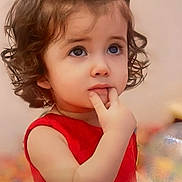 Sofia joined the competition — help win amazing prizes! child, toddler, girl, curly_hair, red_dress, white_skirt, finger_in_mouth, portrait, indoors, cute, young_child, expression, thoughtful, hairband, skin, face, eyes, person, baby, sleeveless