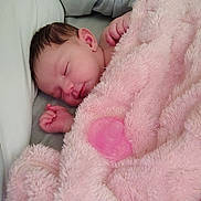 Trinity is registered to the contest to win money with this photo: baby, sleeping, blanket, pink, pacifier, newborn, infant, soft, cozy, cute, face, hand, resting, peaceful, child, portrait, indoors, clothing, fabric, comfort
