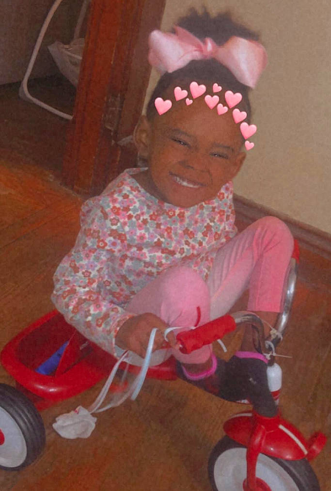 Brooklynn is registered to the contest to win money with this photo: automotive_tire, baby_toddler_clothing, bicycle, bicycle_accessory, child, event, fun, happy, headband, headpiece, headwear, joy, magenta, person, pink, red, riding_toy, smile, tire, toddler