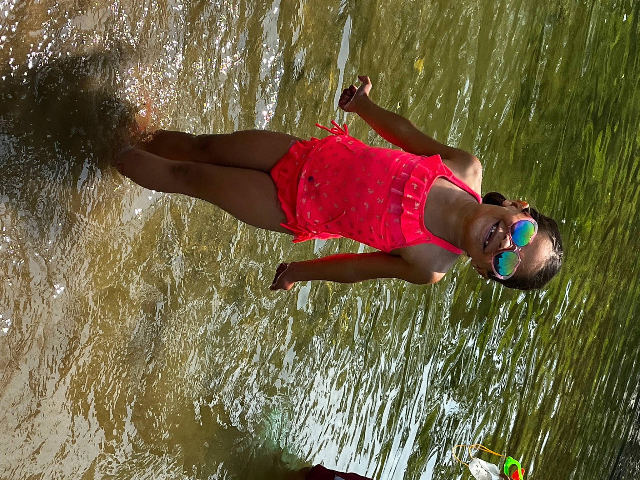 Zaniyah joined the competition — help win amazing prizes! barefoot, beach, boats_and_boating_equipment_and_supplies, body_of_water, endurance_sports, fun, grass, happy, human_leg, joy, lake, leg, leisure, people_in_nature, person, recreation, running, shorts, sports, swimwear