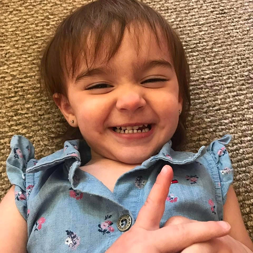 Whitlee is registered to the contest to win money with this photo: child, facial_expression, finger, gesture, hand, happy, joy, laugh, mouth, organ, person, play, skin, smile, thumb, toddler, tooth