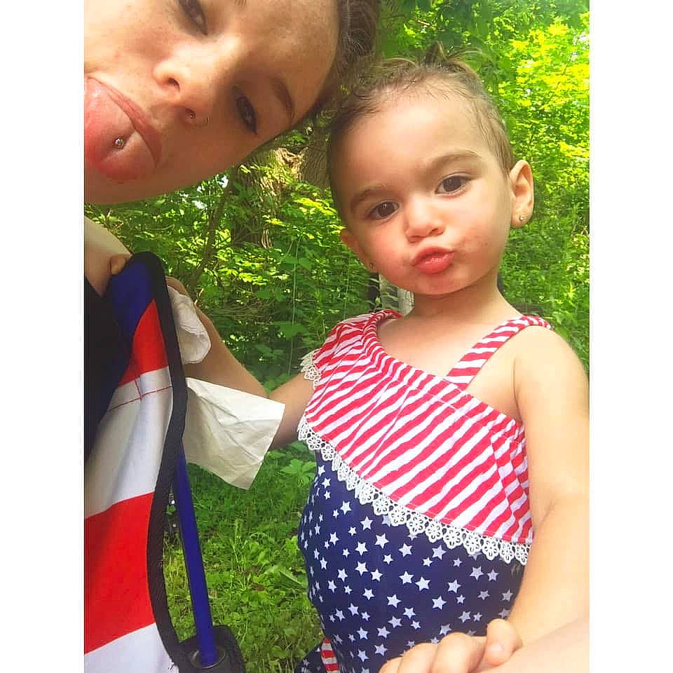 Whitlee is registered to the contest to win money with this photo: baby, baby_products, baby_toddler_clothing, child, clothing, design, dress, grass, green, leaf, one_piece_swimsuit, pattern, person, photography, plant, product, summer, swimwear, t_shirt, toddler