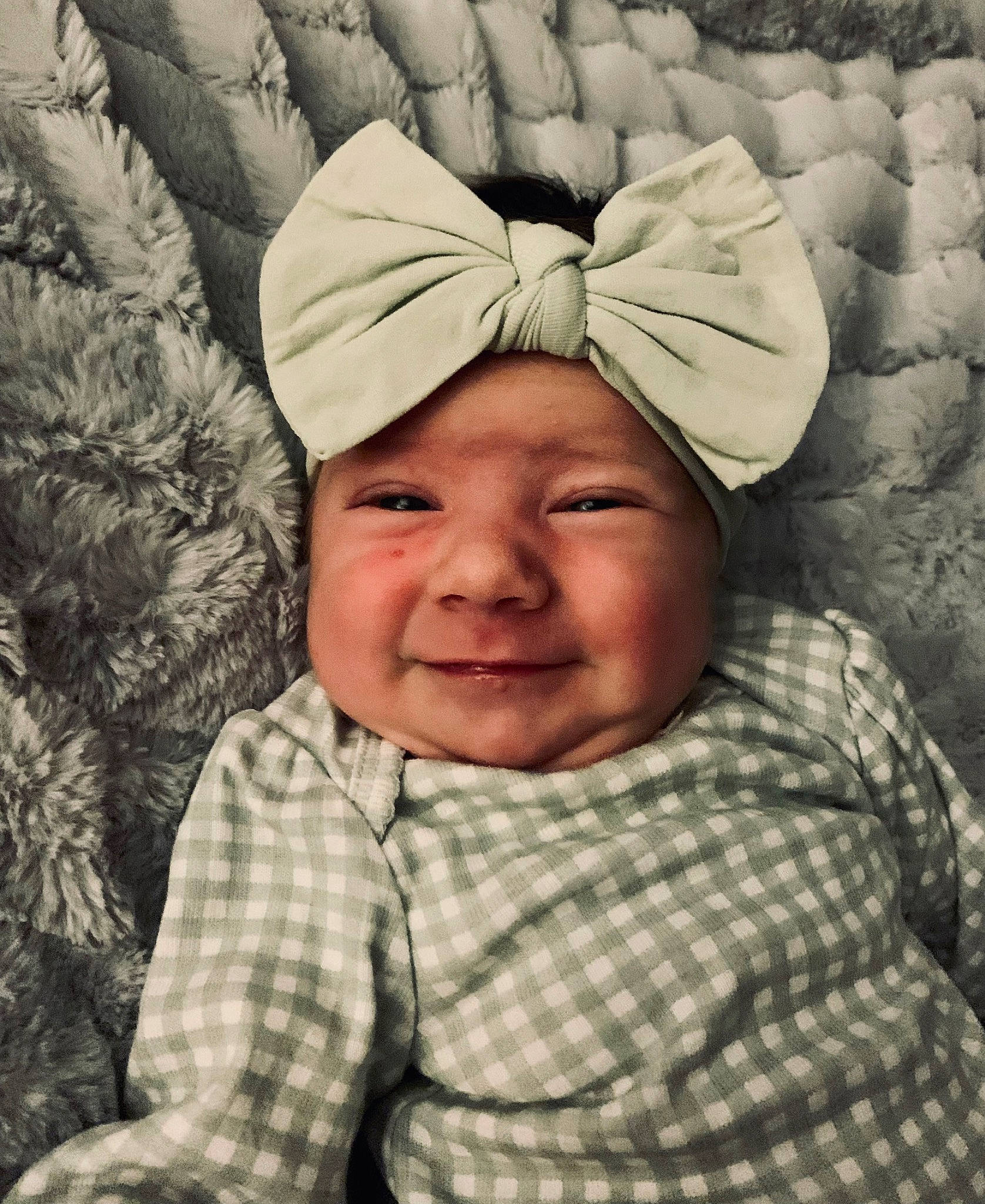 Olivia is registered to the contest to win money with this photo: baby, baby_sleeping, cap, cheek, child, comfort, eye, fun, gesture, happy, headwear, joy, laugh, linens, pattern, people_in_nature, person, photograph, plaid, portrait_photography