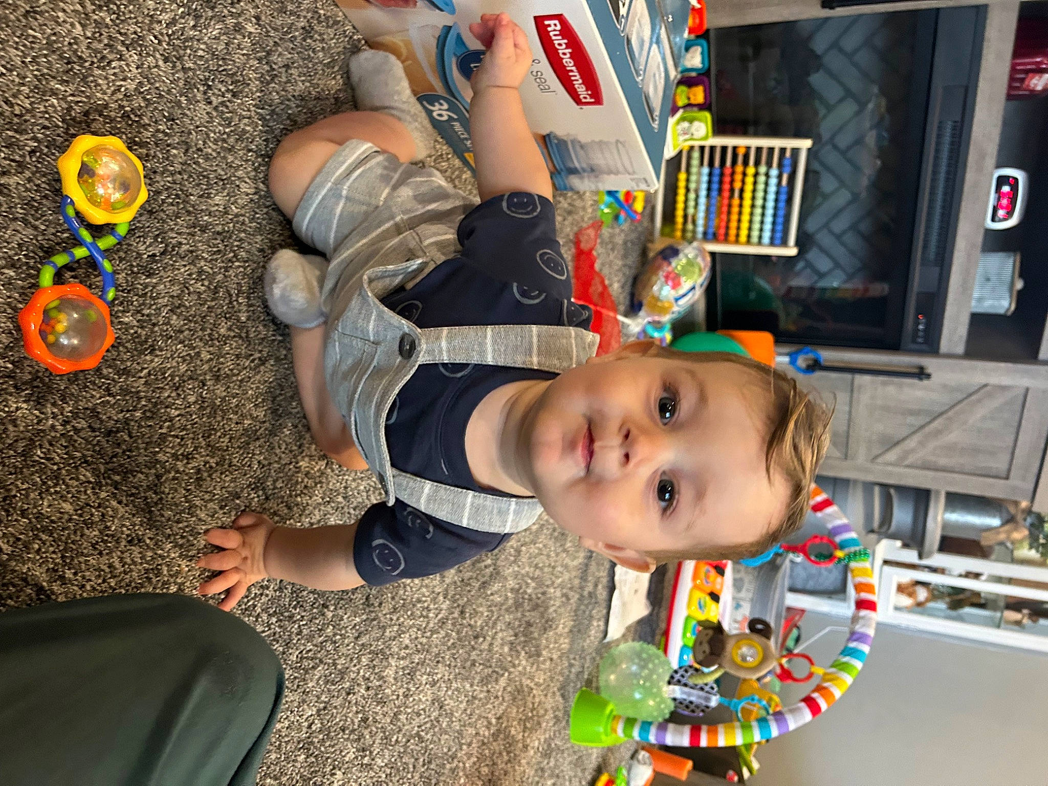 Brody joined the competition — help win amazing prizes! baby, child, flooring, foot, fun, grass, happy, head, human_leg, leisure, person, play, recreation, sitting, smile, t_shirt, toddler, tree, vacation