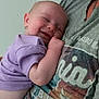 baby, sleeping, smiling, person, child, toddler, purple_clothing, shirt, cuddling, close_up, happy, infant, skin, head, arm, portrait, human, resting, indoor, casual