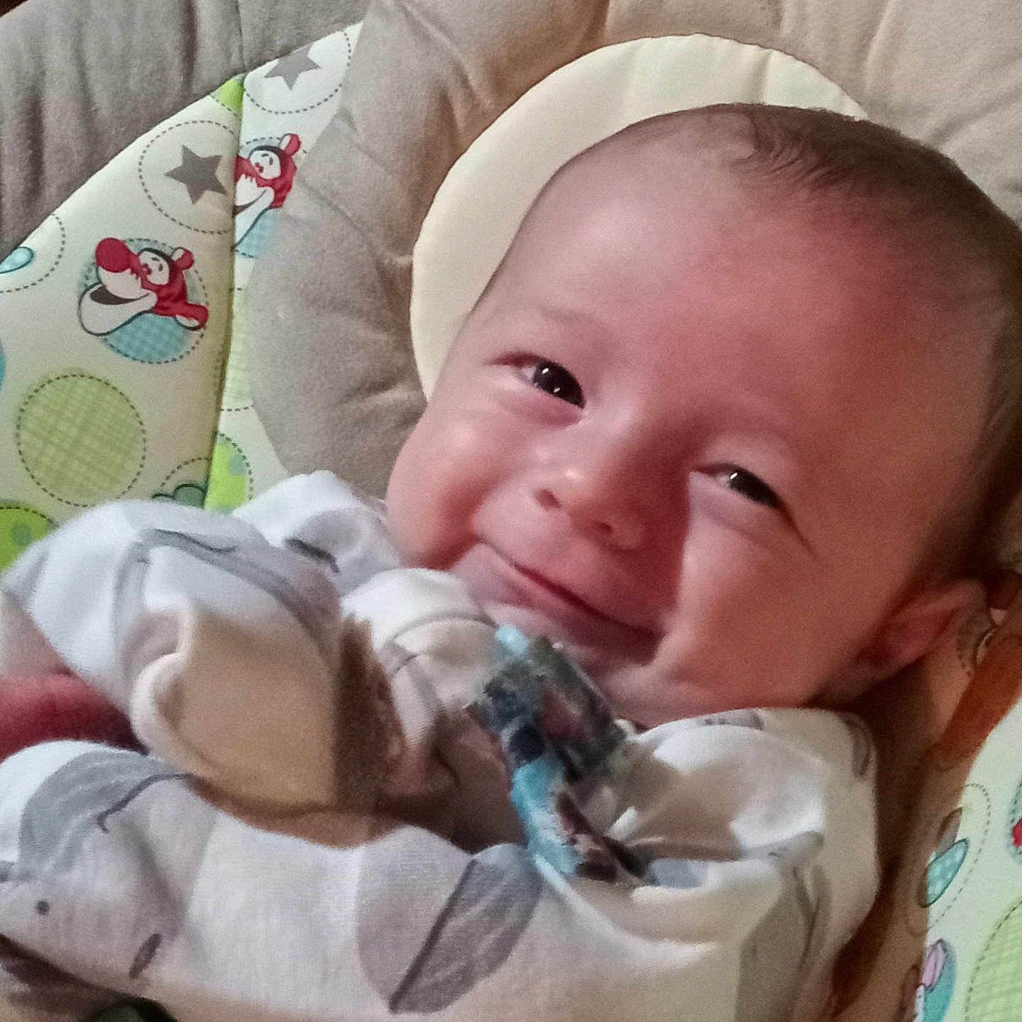 Raylan joined the competition — help win amazing prizes! baby, infant, smile, pajamas, face, cushion, pattern, cartoon, seated, cozy, child, cute, indoor, closeup, happy, young, person, playful, soft, comfort