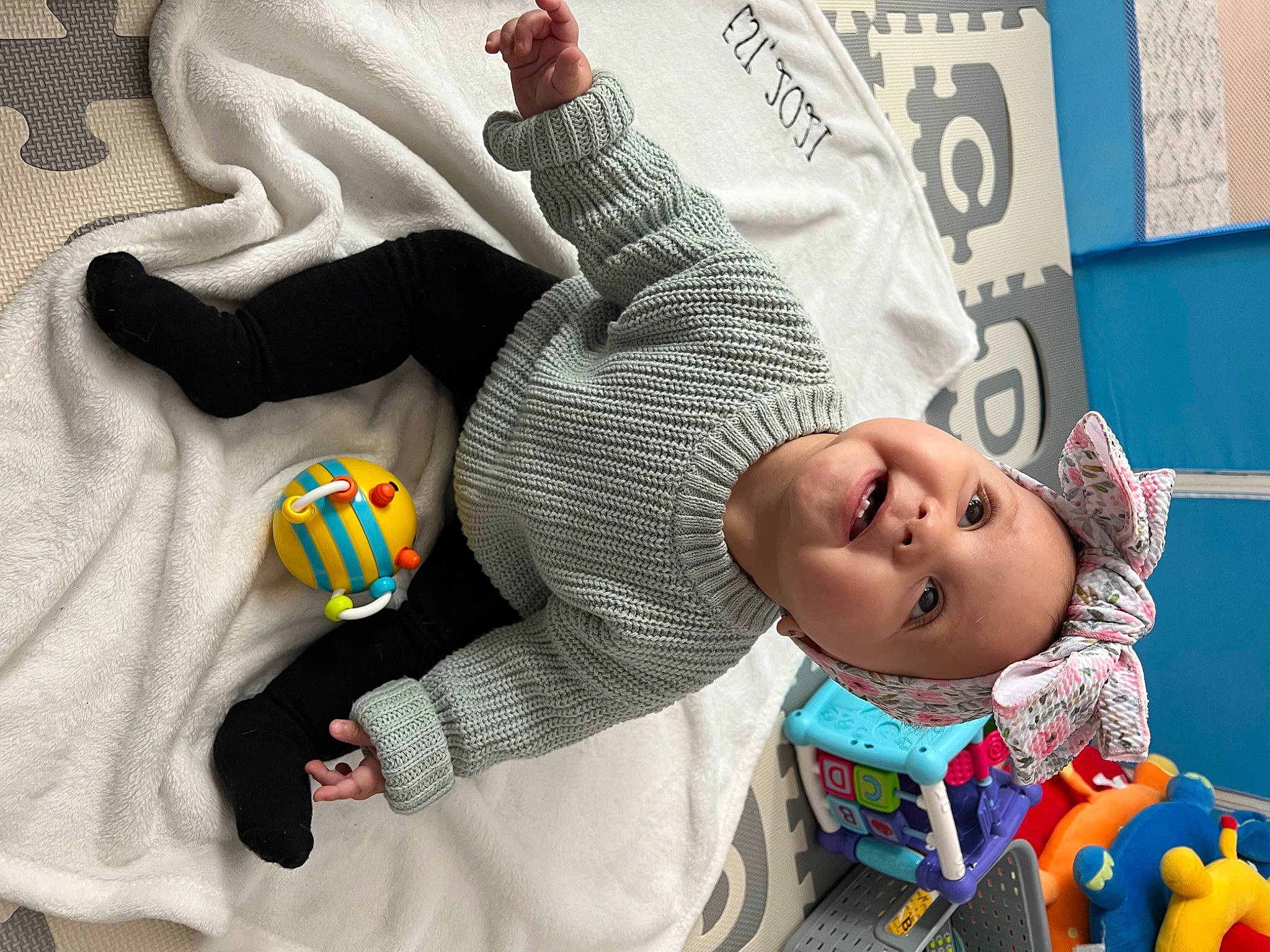 Avalyn Martinez is registered to the contest to win money with this photo: baby, baby_products, child, comfort, finger, fun, gesture, hand, happy, human_body, infant_bed, person, smile, sportswear, stuffed_toy, t_shirt, textile, thumb, toddler, toy