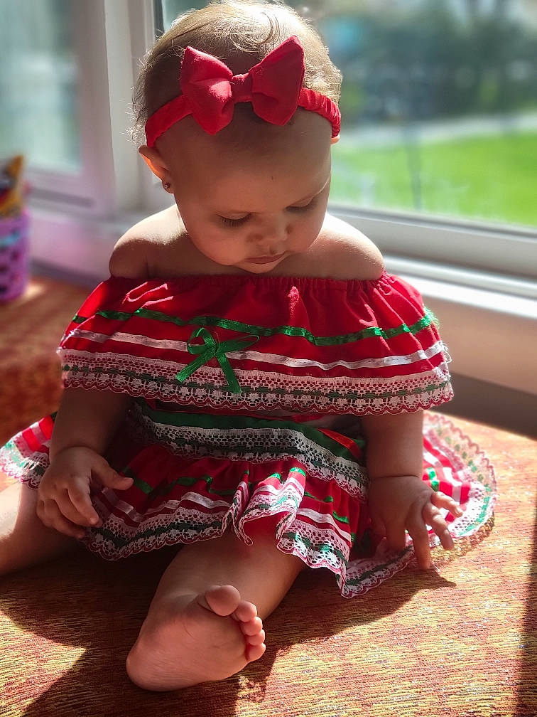 Avalyn Martinez joined the competition — help win amazing prizes! baby, baby_toddler_clothing, cap, child, dress, eyewear, glasses, goggles, grass, happy, neck, pattern, person, pink, plant, red, skin, sleeve, standing, sunglasses