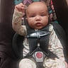 Kayleigh joined the competition — help win amazing prizes! baby, baby_gesture, butterfly_pattern, car_seat, child, child_seat, clothing, cute, expression, face, indoor, infant, onesie, person, portrait, raised_arm, safety_harness, seat, straps, young_child