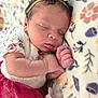 Nariah Alaia Rene' joined the competition — help win amazing prizes! baby, newborn, sleeping, headband, bow, pacifier, blanket, floral_pattern, tutu_skirt, red_skirt, cute, infant, peaceful, soft_texture, closeup, hand, face, lying_down, indoors, portrait