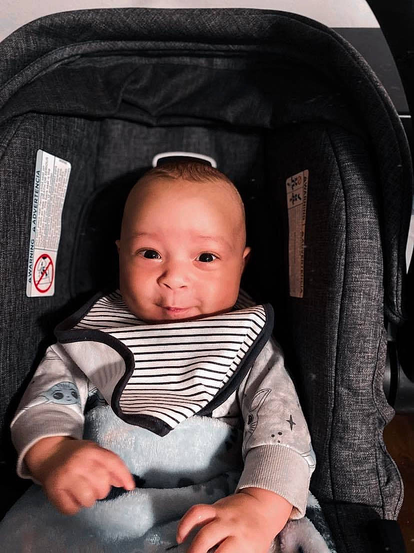 Jakobè joined the competition — help win amazing prizes! arm, auto_part, baby, baby_carriage, baby_in_car_seat, baby_products, baby_safety, baby_toddler_clothing, car_seat, chair, cheek, child, comfort, hand, head_restraint, person, product, seat_belt, sitting, thumb