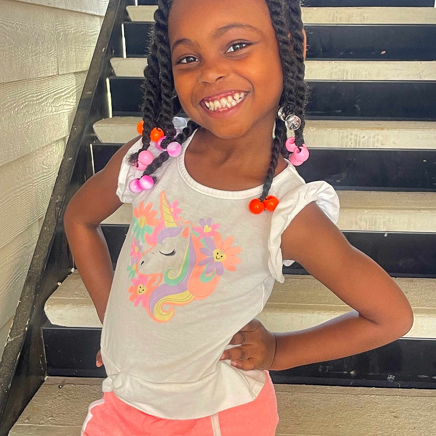 Zahra is registered to the contest to win money with this photo: architecture, blackhair, braid, building, child, clothing, cornrows, dimples, face, female, girl, hair, happy, head, house, housing, person, shorts, sleeve, staircase