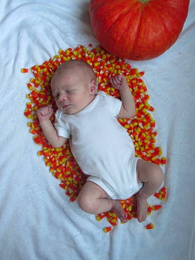 Caspian joined the competition — help win amazing prizes! baby, baby_toddler_clothing, calabaza, comfort, fruit, gourd, human_body, linens, natural_foods, orange, person, plant, produce, pumpkin, red, skin, sleeve, squash, toddler, vegetable