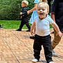 toddler, child, kids, dance_floor, outdoor, grass, trees, smiling, happy, group, party, casual_clothing, socks, necklace, little_boy, walking, playful, portrait, celebration, family_event
