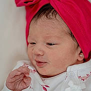 Victoria is registered to the contest to win money with this photo: newborn, baby, infant, headwrap, pink, bow, onesie, white, floral, clothing, cute, face, hand, skin, earring, portrait, sleepy, small, child, soft