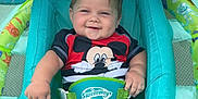 Dallas is registered to the contest to win money with this photo: baby, infant, smile, swimwear, float, water, outdoor, summer, child, mickey_mouse, swimming_pool, sunshade, happy, cute, relaxing, toy, blue, green, toddler, playtime