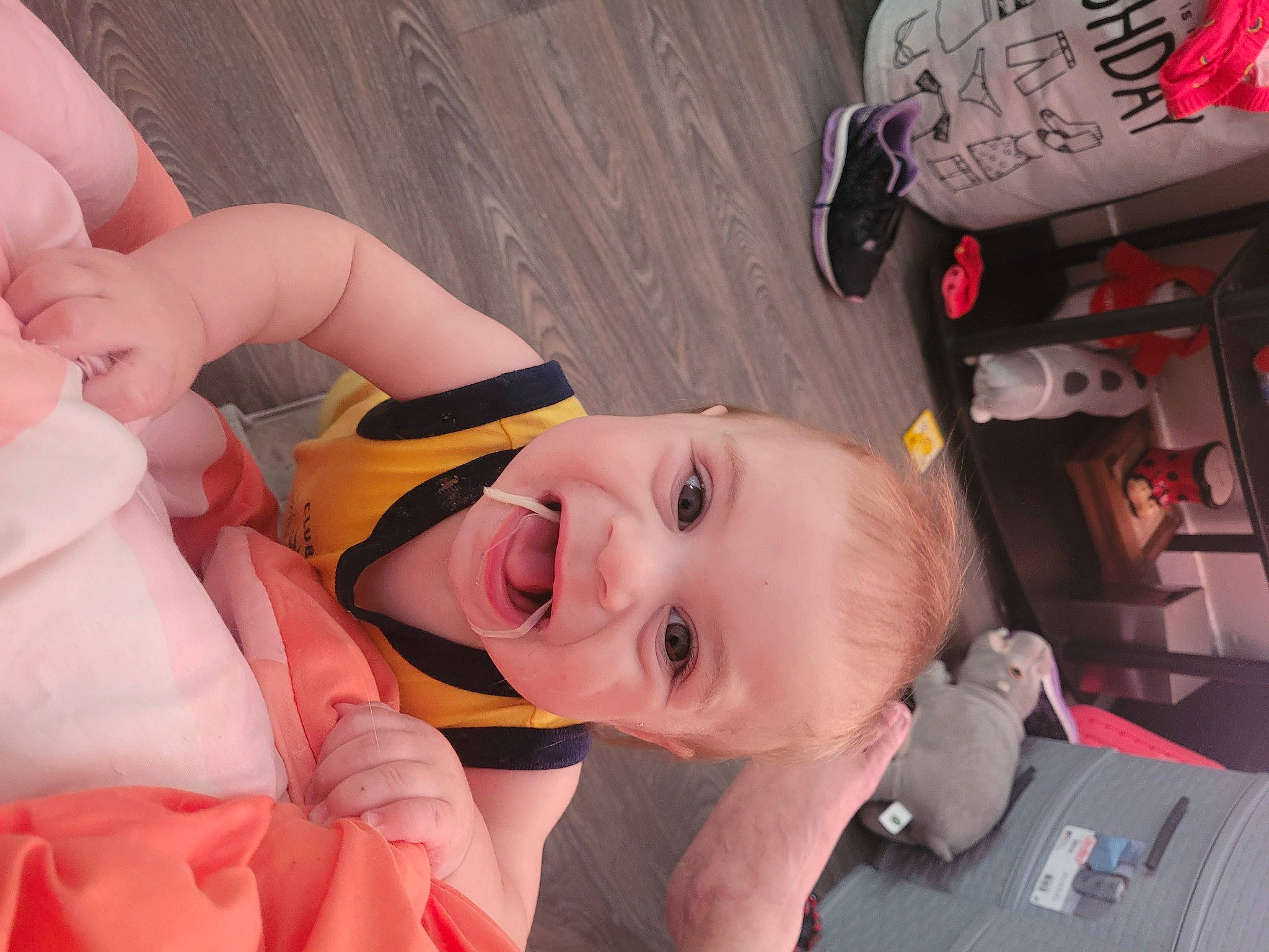 Lennox is registered to the contest to win money with this photo: baby, baby_products, child, eyebrow, eyelash, fun, happy, mouth, nose, person, personal_protective_equipment, pink, room, smile, toddler