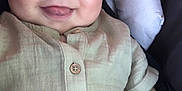 William joined the competition — help win amazing prizes! baby, infant, smile, tongue, face, eyes, clothing, beige, cute, child, person, happy, portrait, sitting, cushion, seat, soft, skin, hand, button