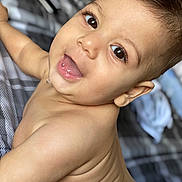 Matteo is registered to the contest to win money with this photo: baby, child, smiling, face, eyes, drool, skin, hair, bed, blanket, crawling, happy, cute, infant, portrait, closeup, indoors, young, person, expression
