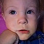 Rollin is registered to the contest to win money with this photo: toddler, child, close_up, face, hand, blue_clothing, curious_eyes, indoor, soft_lighting, portrait, young_child, resting_chin, expression, skin, eyelashes, nose, mouth, casual, cozy, intimate