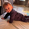 Sacha participe au concours pour gagner de l'argent avec cette photo : baby, child, infant, smile, face, indoors, blanket, floor, clothing, purple_outfit, curious, crawling, light, window, home, portrait, cute, young_child, person, toddler