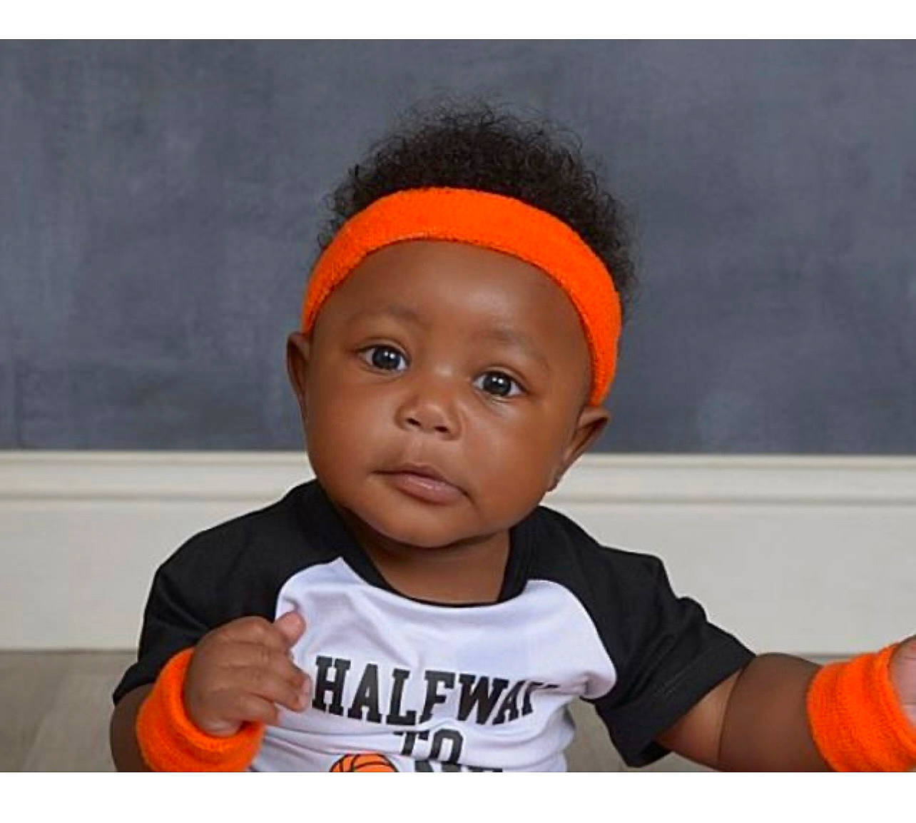 Jordan is registered to the contest to win money with this photo: baby, baby_toddler_clothing, beanie, cap, cheek, child, fashion_accessory, happy, person, portrait_photography, room, sleeve, t_shirt, toddler