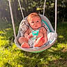 Kameron joined the competition — help win amazing prizes! baby, swing, outdoor, sunlight, blanket, grass, trees, infant, playful, child, seat, nature, sunshine, greenery, summer, cute, portrait, relaxing, babywear, daylight