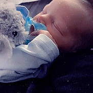 Elijah joined the competition — help win amazing prizes! baby, sleeping, pacifier, stuffed_animal, soft_toy, infant, hand, face, clothing, resting, cozy, closeup, child, newborn, peaceful, cute, indoor, portrait, comfort, blanket