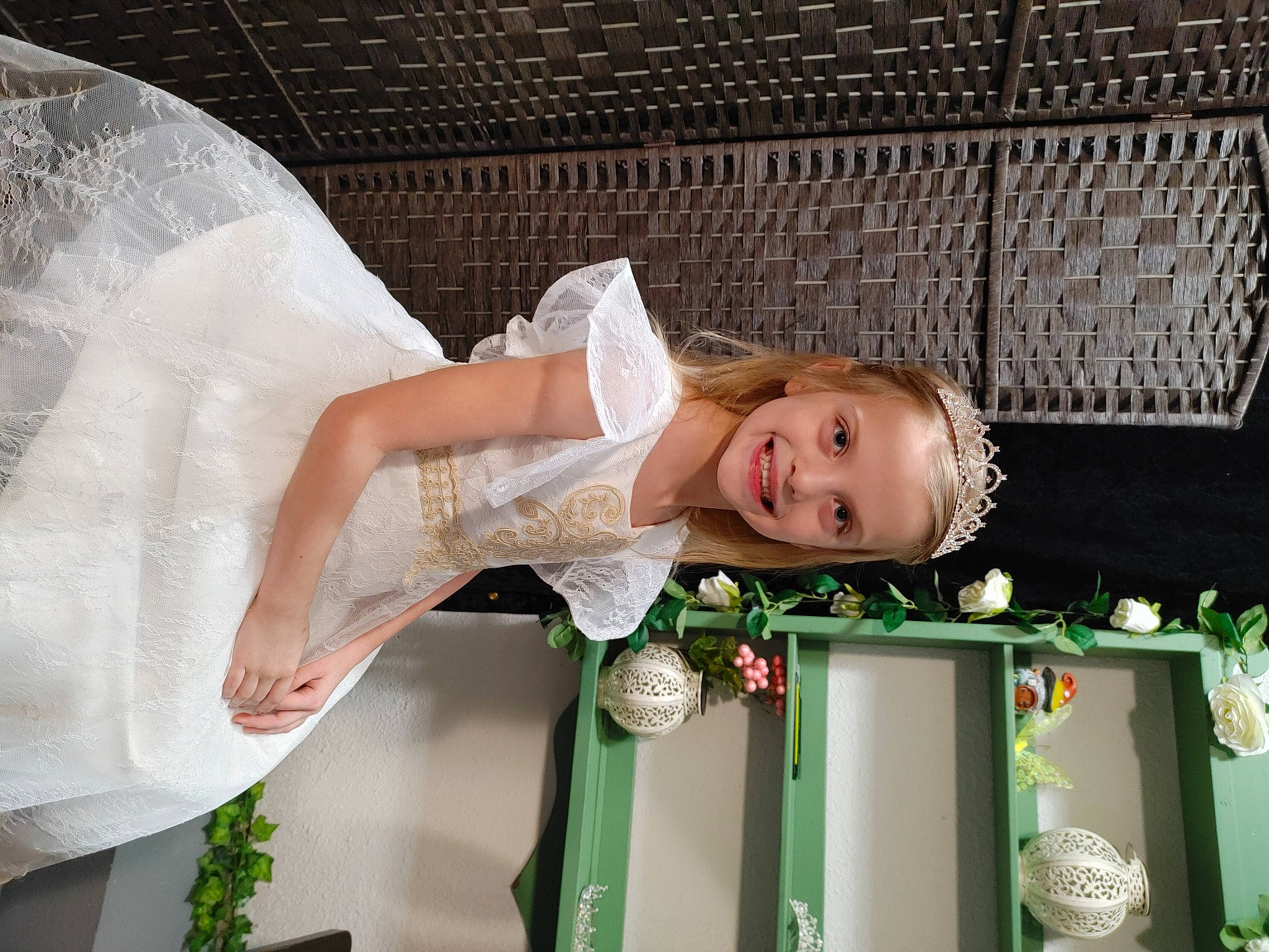 Elie is registered to the contest to win money with this photo: baby, baby_products, baby_toddler_clothing, bridal_accessory, bridal_clothing, bridal_veil, child, dress, event, flash_photography, fun, grass, green, happy, joy, leisure, person, room, smile, toddler