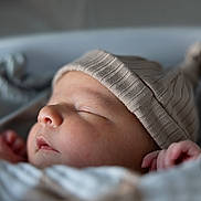 Asher joined the competition — help win amazing prizes! baby, blanket, child, closeup, cozy, cute, face, hat, indoors, infant, newborn, peaceful, portrait, rest, skin, sleeping, small, soft, warm, wrapped