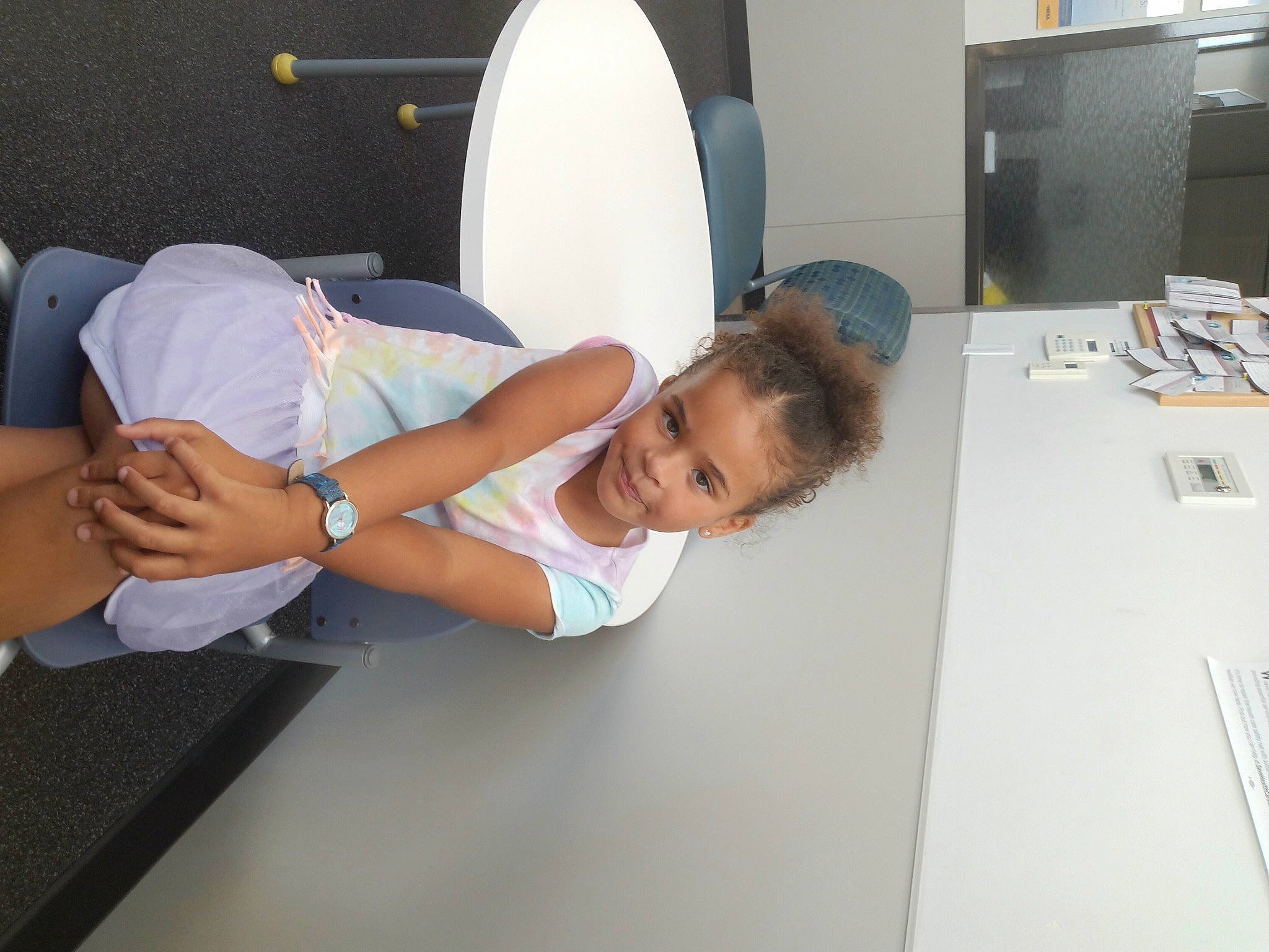 Airahnna is registered to the contest to win money with this photo: arm, automotive_design, chair, comfort, computer_monitor, desk, elbow, fun, human_leg, joy, knee, leisure, person, room, service, shorts, sitting, t_shirt, table, thigh