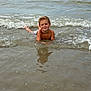 child, boy, water, sea, waves, beach, smiling, outdoor, summer, nature, ocean, sky, swimwear, wet, sand, reflection, shore, playing, young, happy