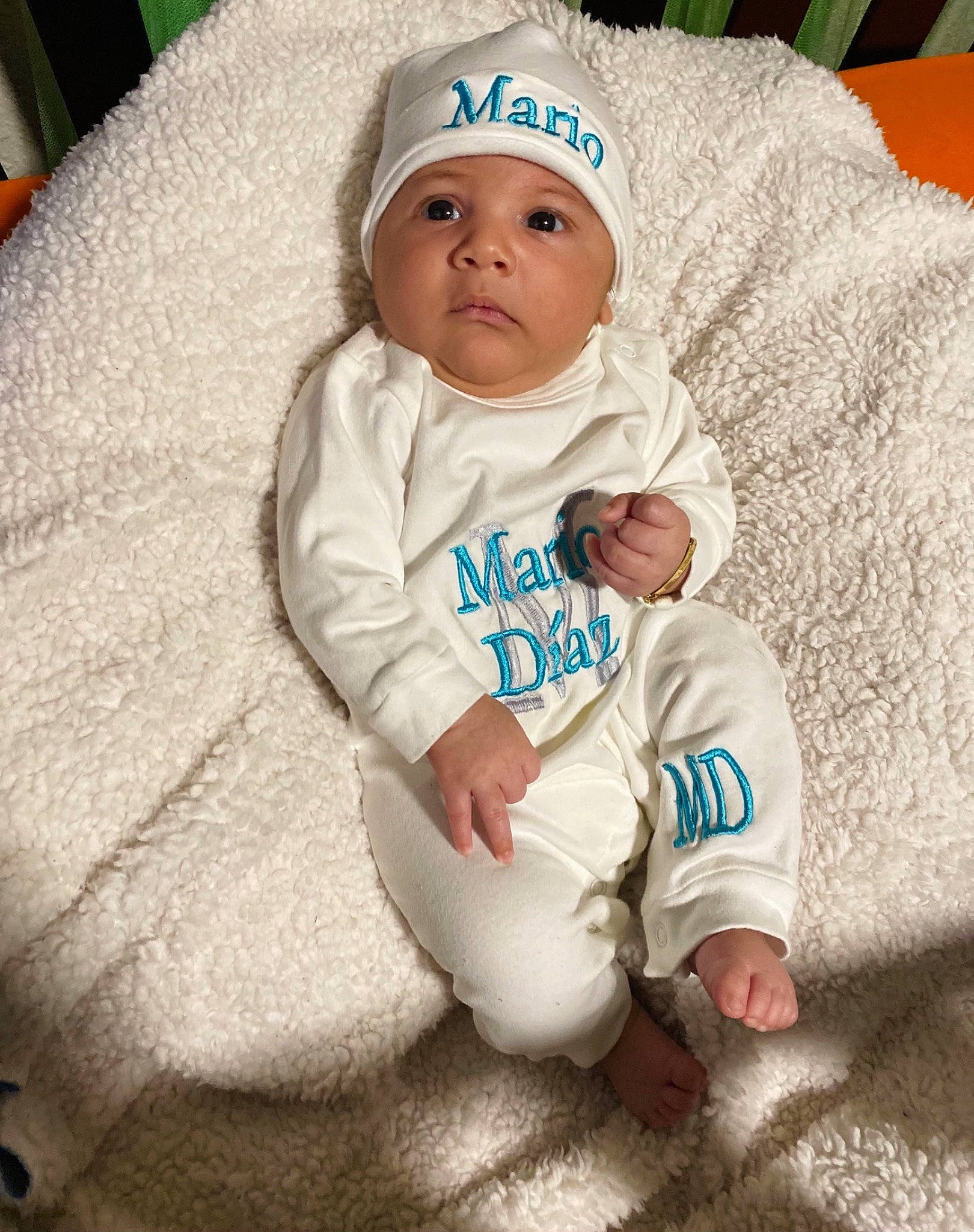 Mario is registered to the contest to win money with this photo: baby, baby_products, baby_sleeping, baby_toddler_clothing, cap, cheek, child, comfort, eye, face, grass, happy, head, headgear, headwear, knit_cap, linens, person, sitting, skin