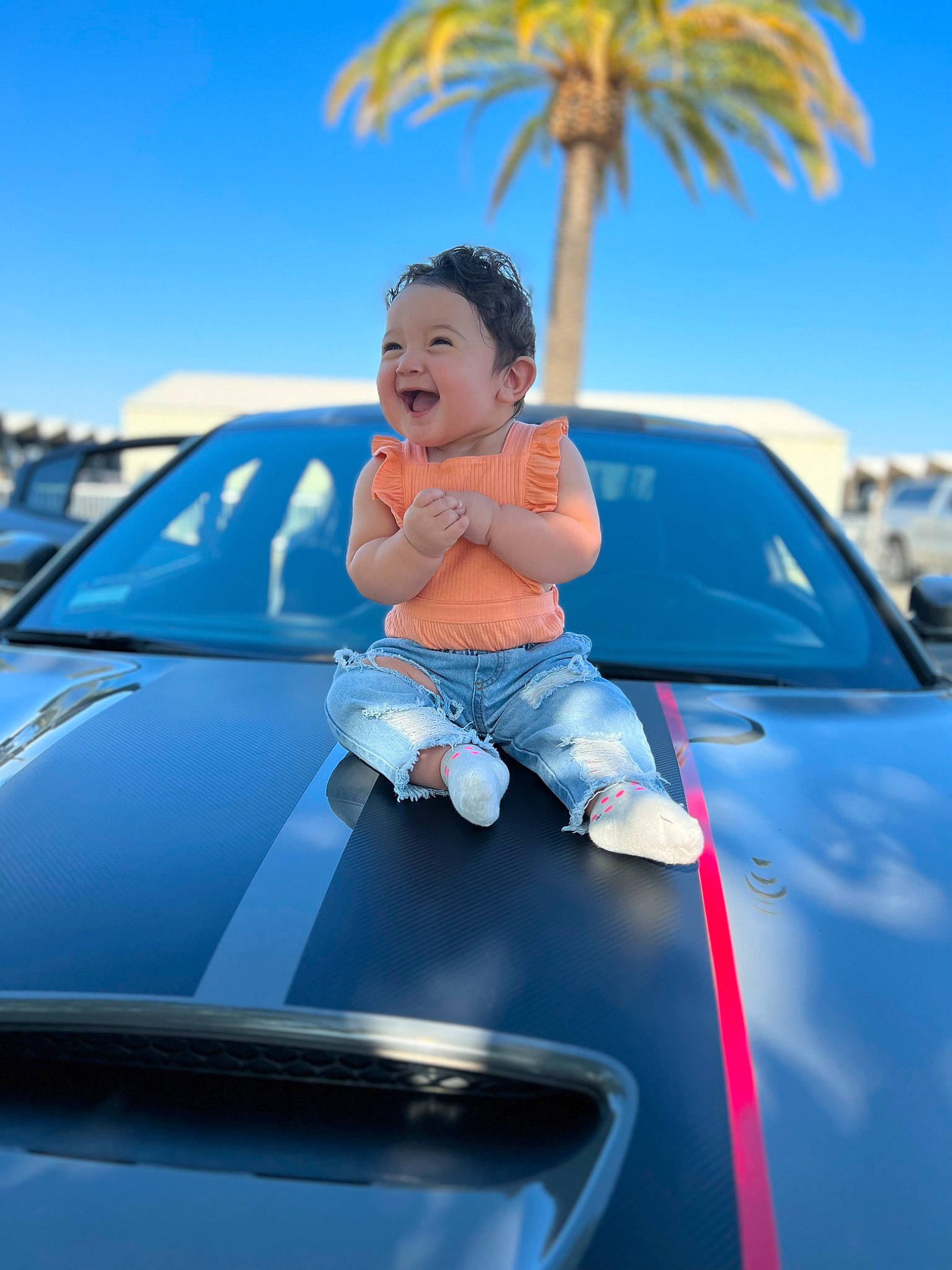 Alaia is registered to the contest to win money with this photo: auto_part, automotive_design, automotive_exterior, automotive_lighting, bumper, car, electric_blue, glass, headlamp, hood, joy, mode_of_transport, motor_vehicle, person, personal_luxury_car, sky, tints_and_shades, toddler, tree, vehicle