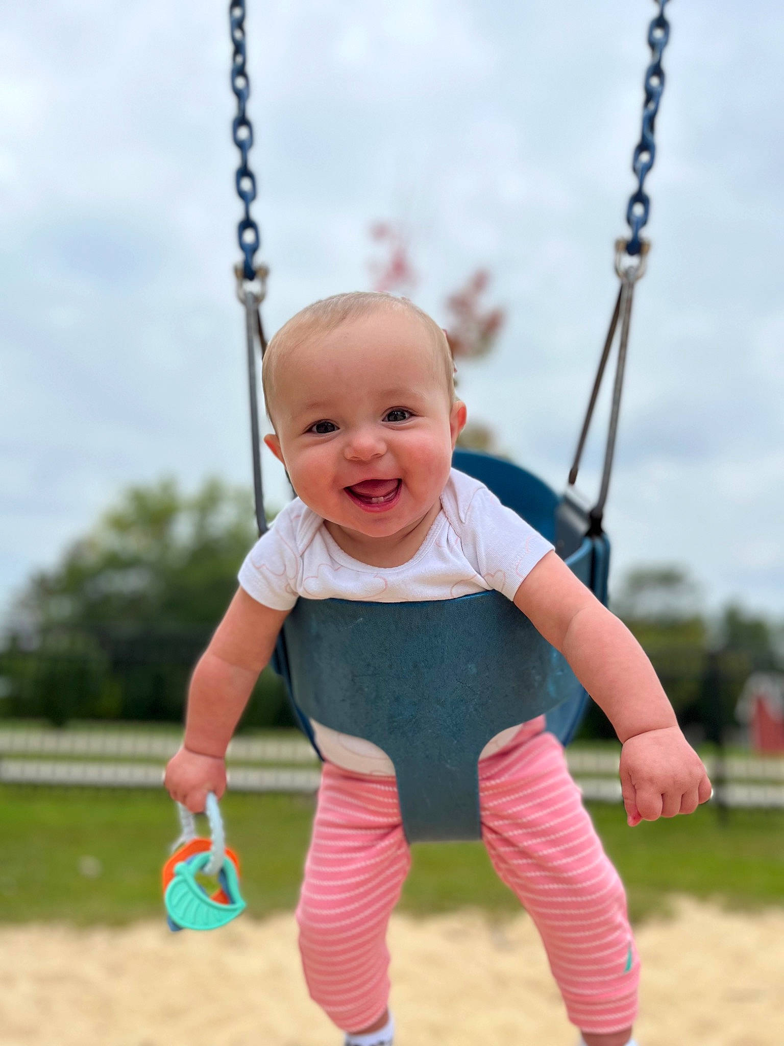Ellianna joined the competition — help win amazing prizes! baby, baby_toddler_clothing, child, cloud, electric_blue, finger, fun, grass, happy, human_settlement, joy, leisure, person, photograph, playground, public_space, recreation, sky, smile, swing