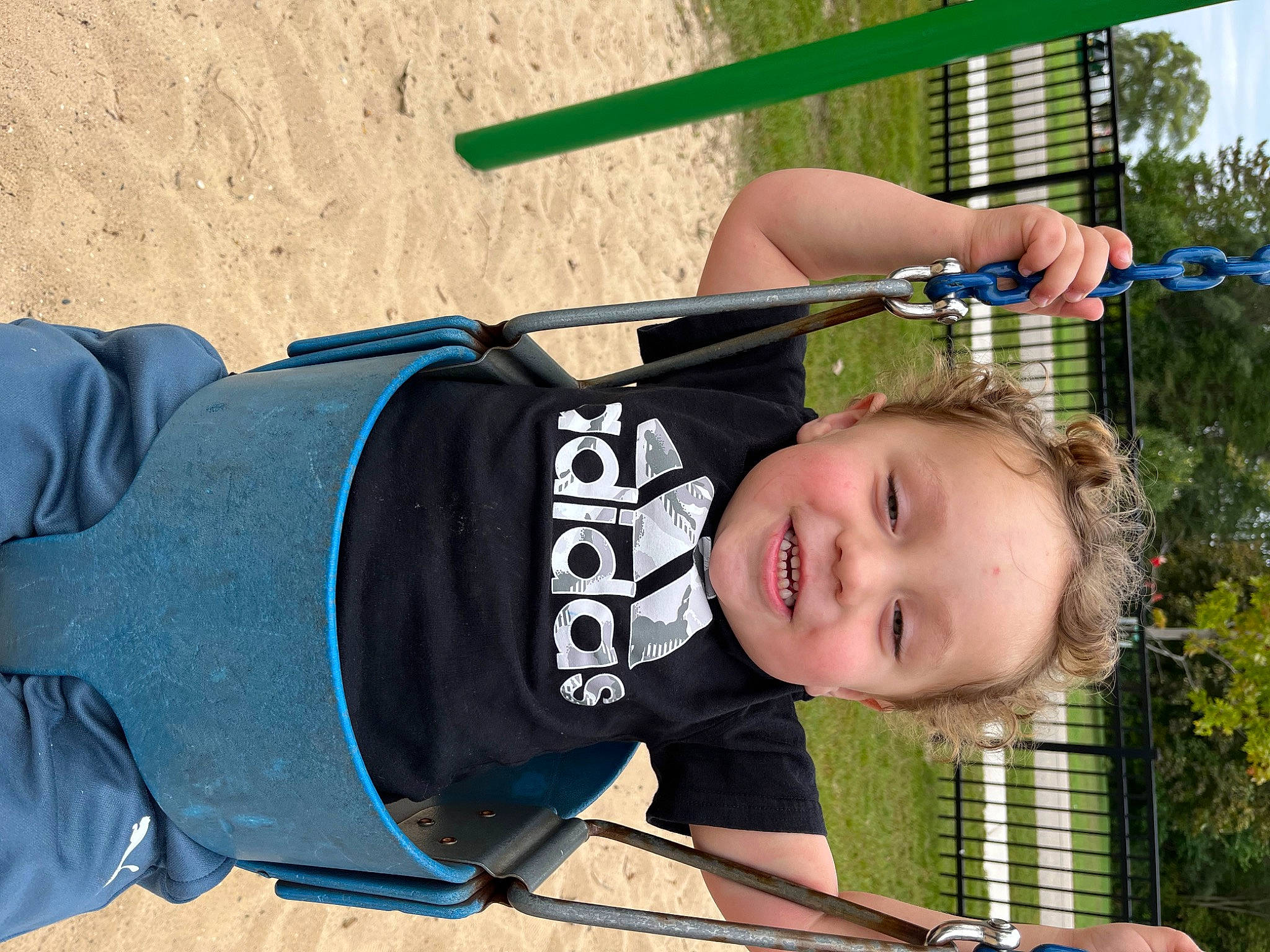 Quinten is registered to the contest to win money with this photo: beach, child, electric_blue, fun, grass, happy, joy, leisure, person, personal_protective_equipment, plant, recreation, sleeve, smile, toddler, tree