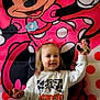 Braeleigh joined the competition — help win amazing prizes! child, girl, smile, bow, sweatshirt, wranglin_mini, minnie_mouse, cookie, cartoon, backdrop, red, pink, white, polka_dots, happy, portrait, indoor, person, holding, celebration