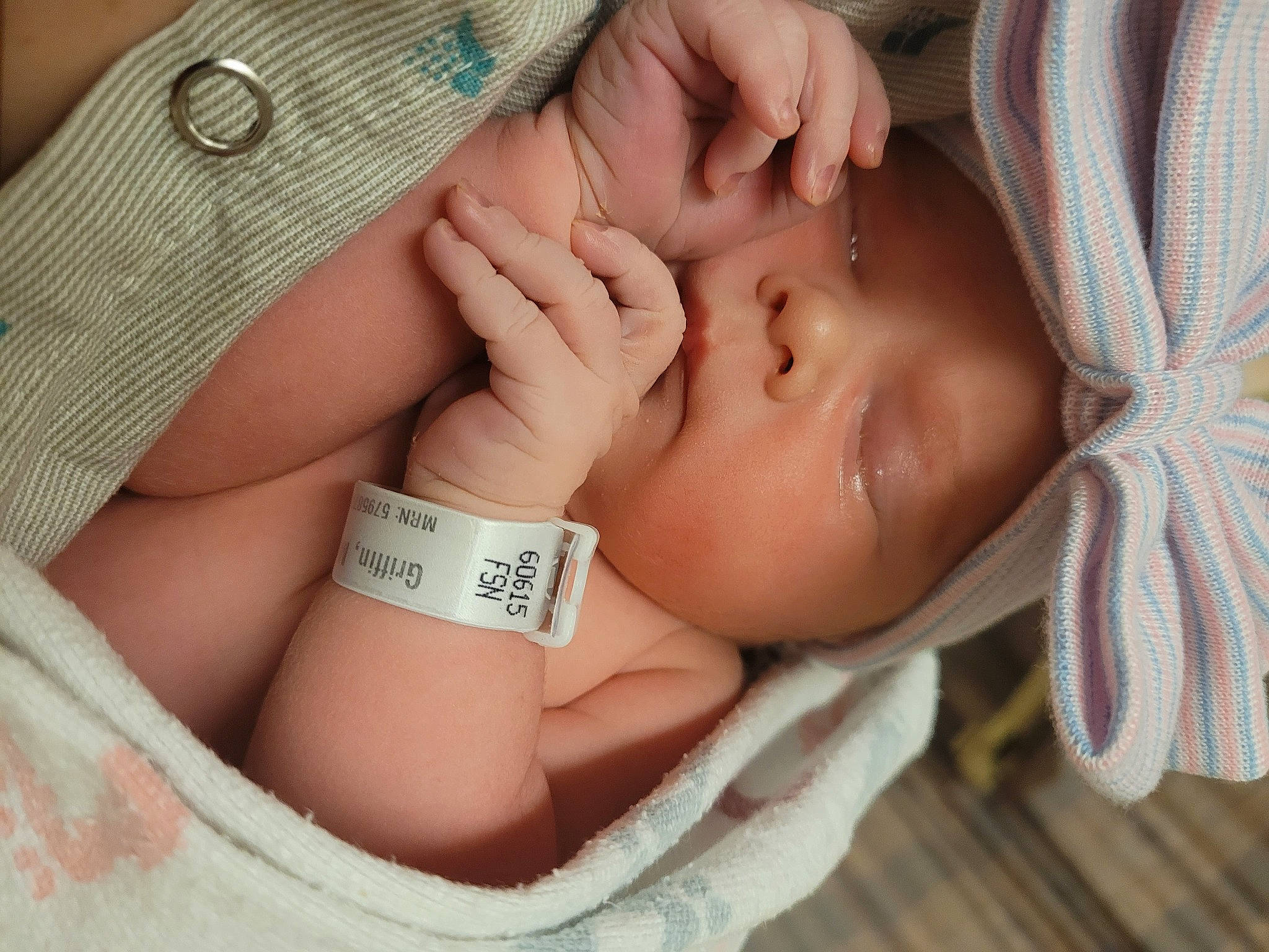 Annalise is registered to the contest to win money with this photo: arm, baby, cheek, comfort, ear, eye, eyebrow, eyelash, finger, gesture, hand, head, headwear, human_body, leg, lip, mouth, neck, nose, person