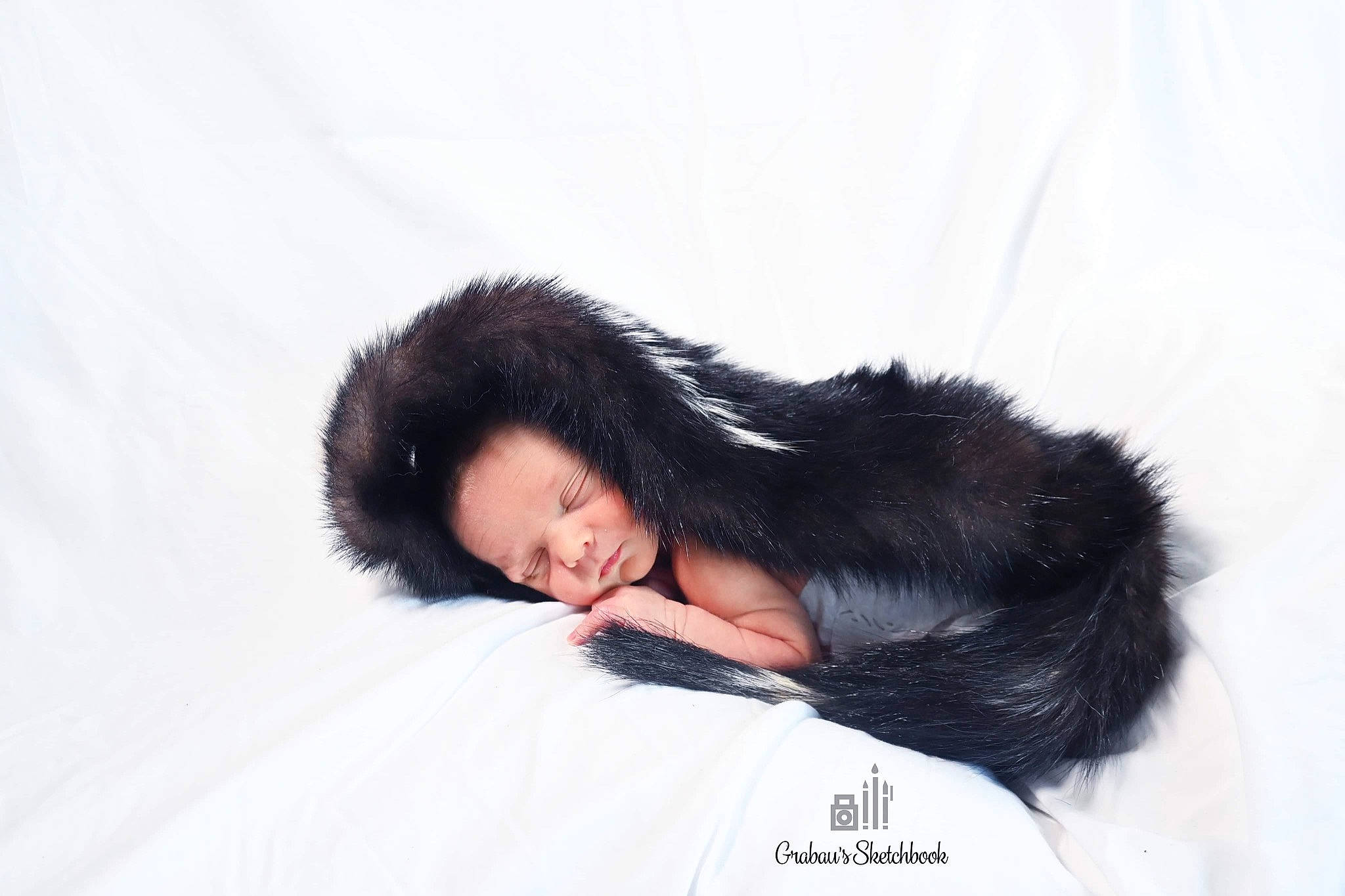 Jeffrey is registered to the contest to win money with this photo: bed, bedding, black_hair, brown_hair, comfort, dress, elbow, eye, eyelash, flash_photography, fur, gesture, happy, human_leg, leg, linens, long_hair, person, sitting, sleeve