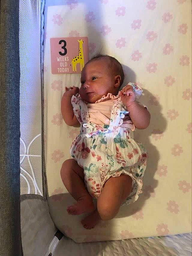 Maizie joined the competition — help win amazing prizes! baby, baby_products, baby_toddler_clothing, cheek, chest, child, comfort, finger, fun, happy, linens, magenta, pattern, person, pink, room, sitting, skin, thigh, thumb