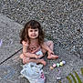 child, girl, chalk, sidewalk, curly_hair, barefoot, smiling, outdoor, play, concrete, plastic_bag, pastel_colors, drawing, casual_clothing, young, fun, happy, daylight, nature, relaxed