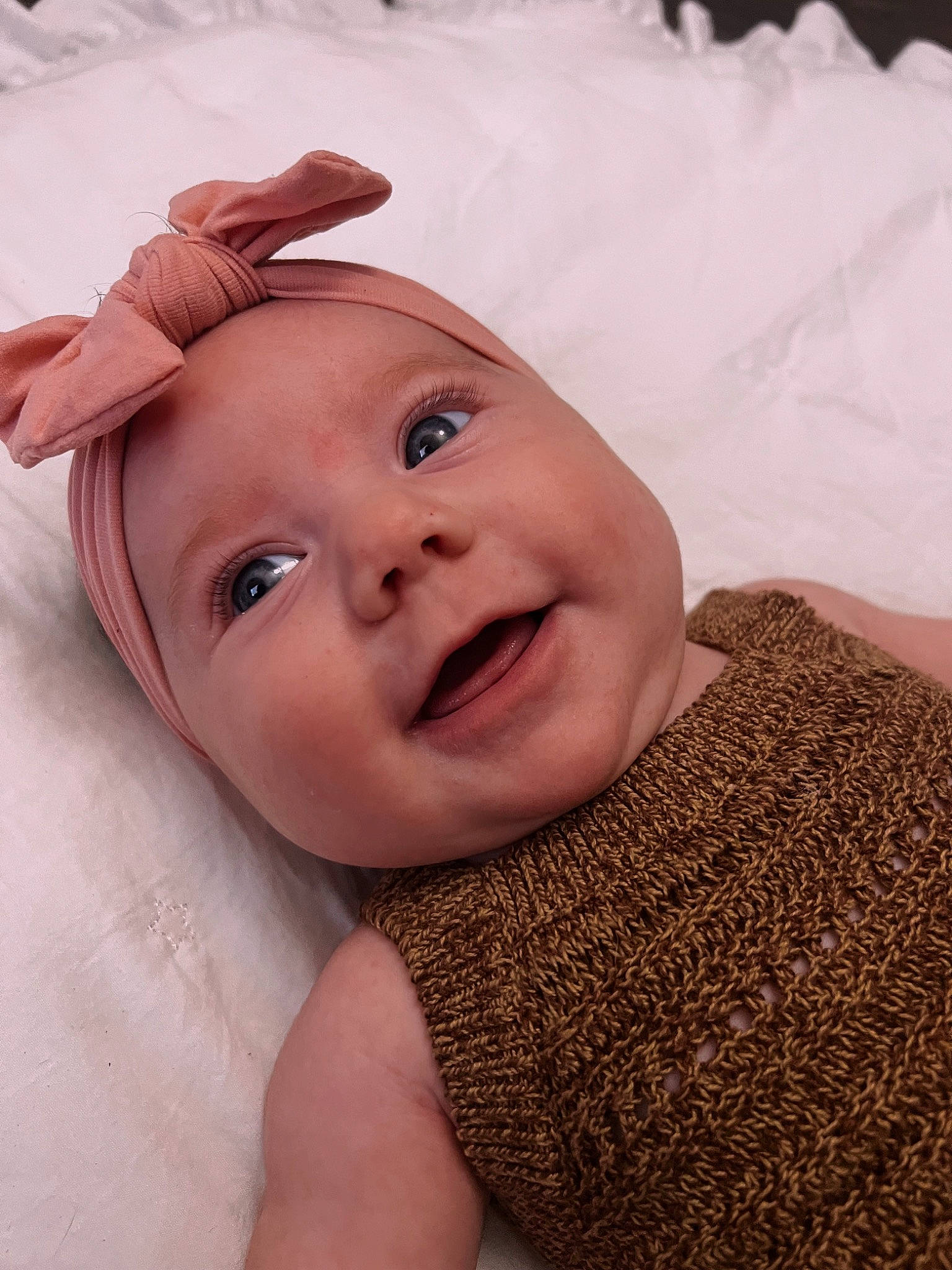 Emily is registered to the contest to win money with this photo: baby, cheek, chin, comfort, eye, eyebrow, eyelash, face, fun, gesture, happy, head, iris, lip, mouth, nose, person, skin, smile, textile