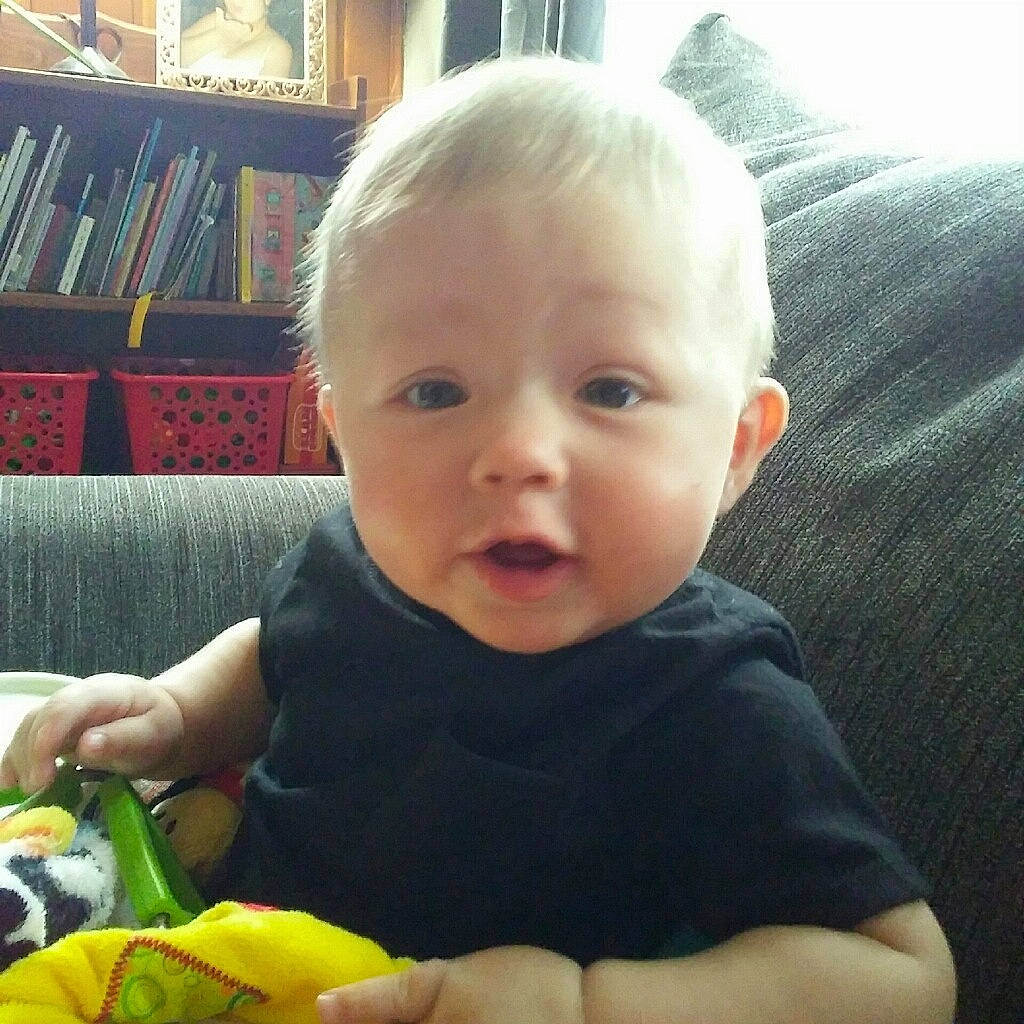 Grady is registered to the contest to win money with this photo: baby, cheek, child, ear, eating, eye, face, finger, happy, head, iris, lip, mouth, nose, person, play, sitting, skin, smile, toddler